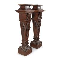 A Pair of English Carved Walnut and Marble Top Pedestals