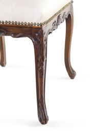 A Pair of Louis XV Style Carved Walnut Side Chairs