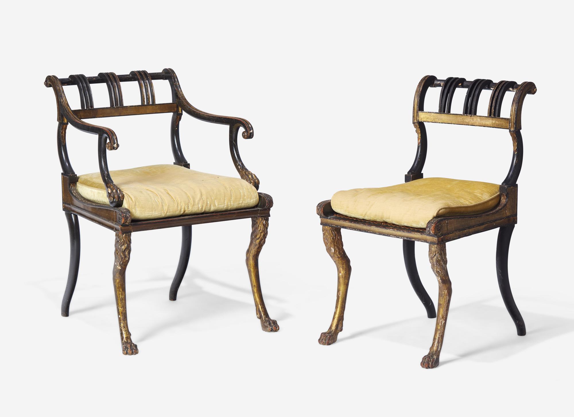 A Set of Three Regency Parcel-Gilt and Ebonized Caned Seat Dining Chairs