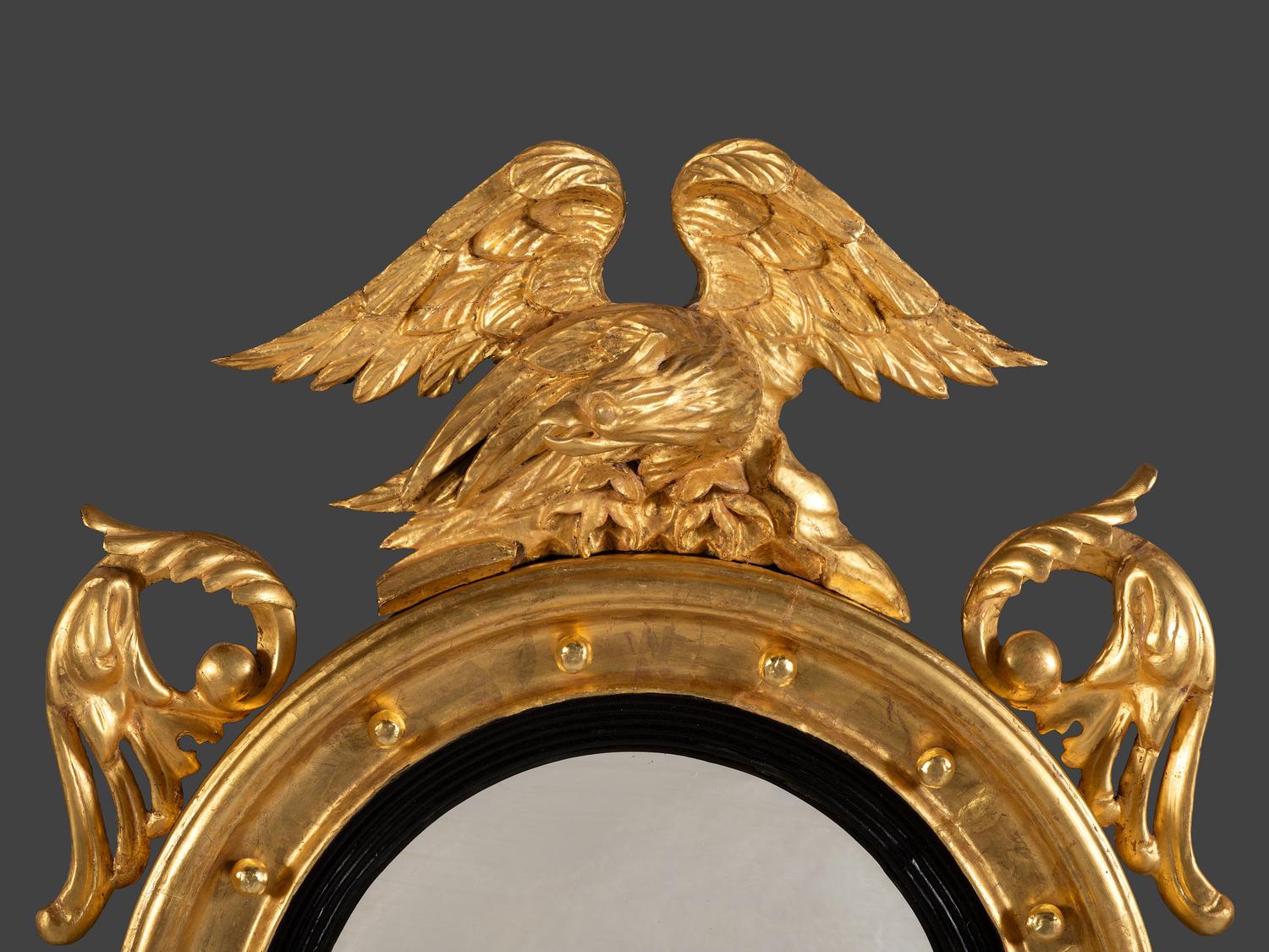 A Pair of Federal Giltwood Bull's Eye Looking Glasses