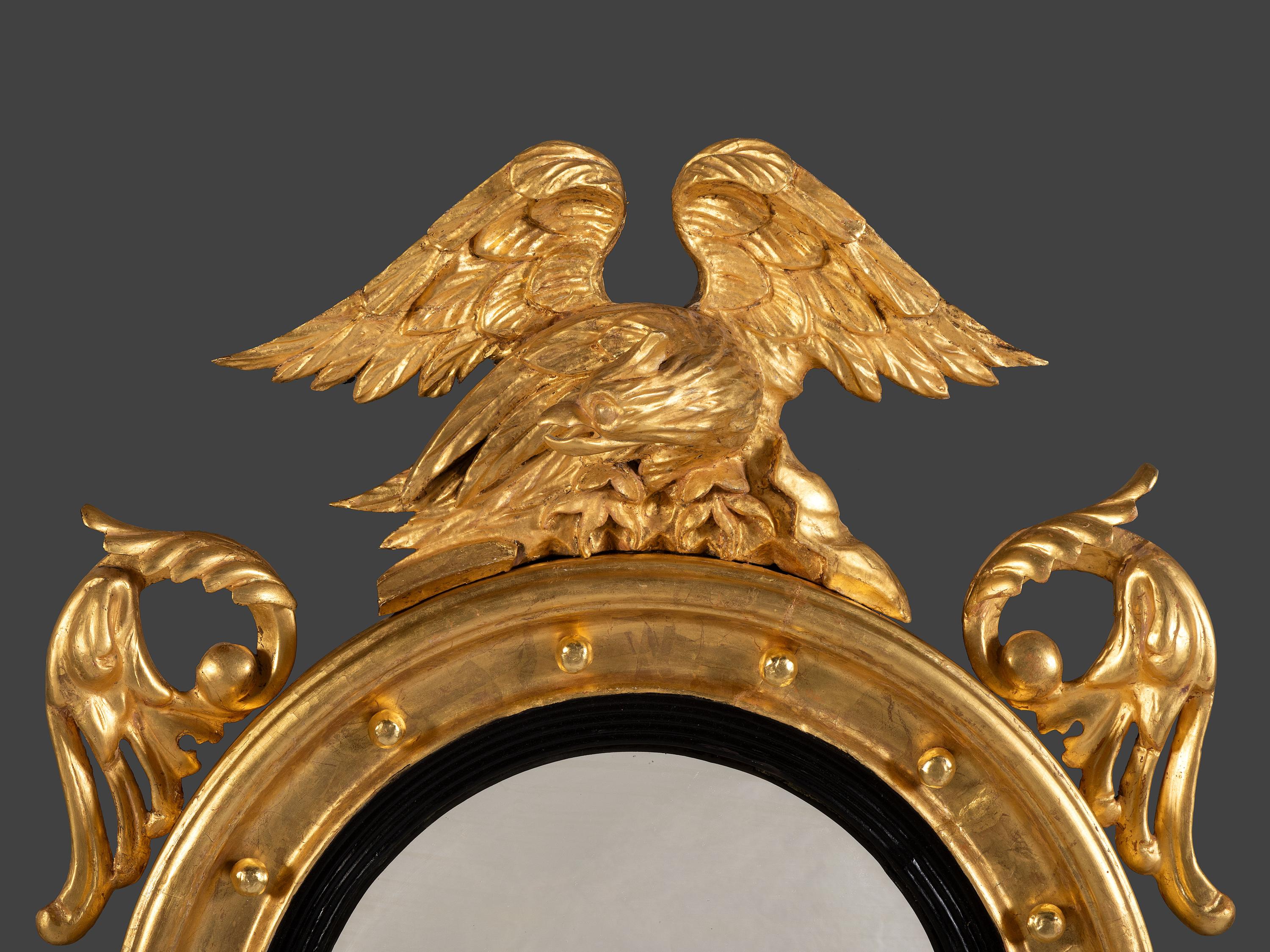 A Pair of Federal Giltwood Bull's Eye Looking Glasses