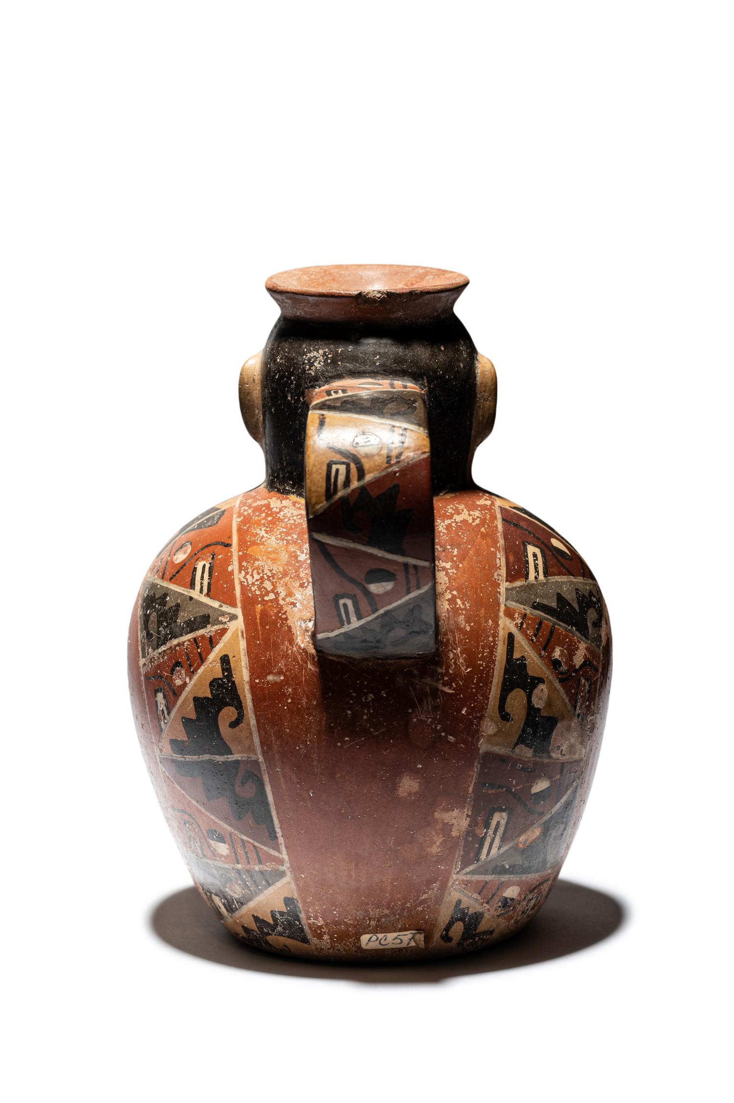 A Huari Man with Poncho Vessel