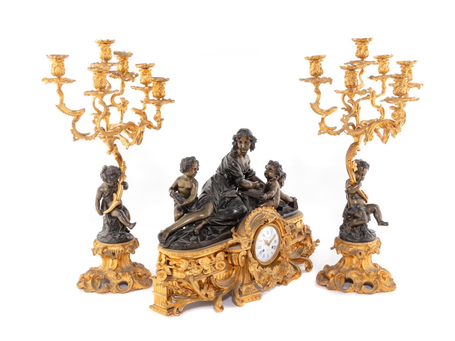 A French Gilt and Patinated Bronze Clock Garniture