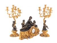 A French Gilt and Patinated Bronze Clock Garniture