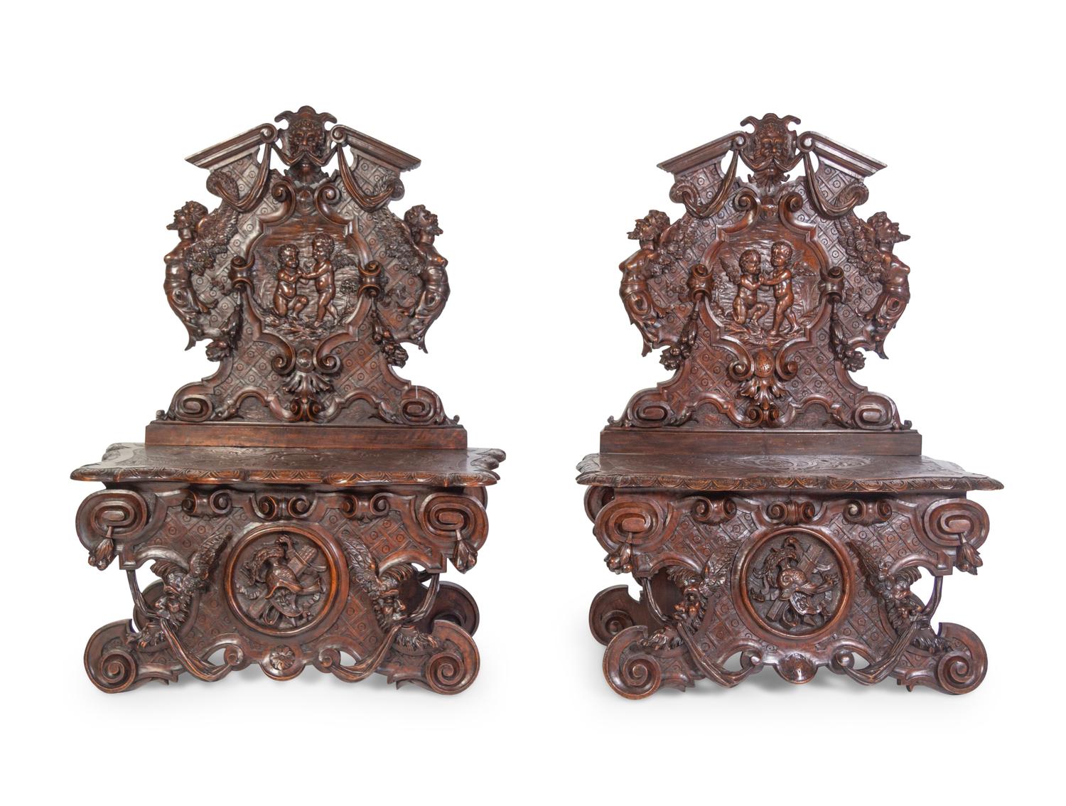 A Pair of Italian Baroque Style Carved Walnut Benches