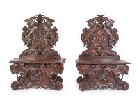 A Pair of Italian Baroque Style Carved Walnut Benches
