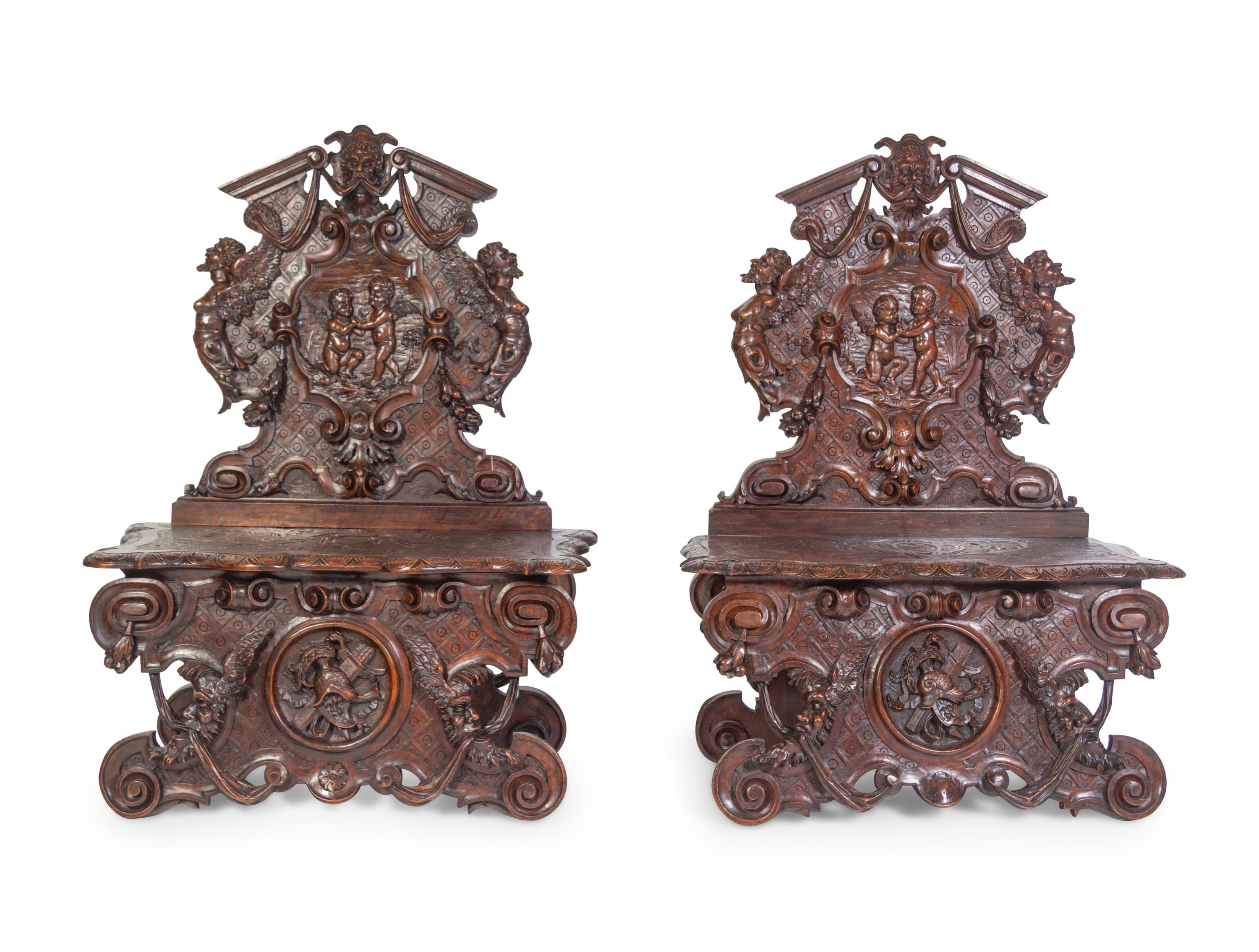 A Pair of Italian Baroque Style Carved Walnut Benches