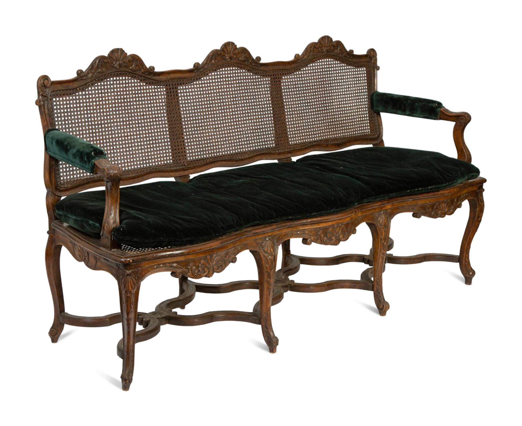 A Régence Style Carved Walnut Triple Chair-Back Settee