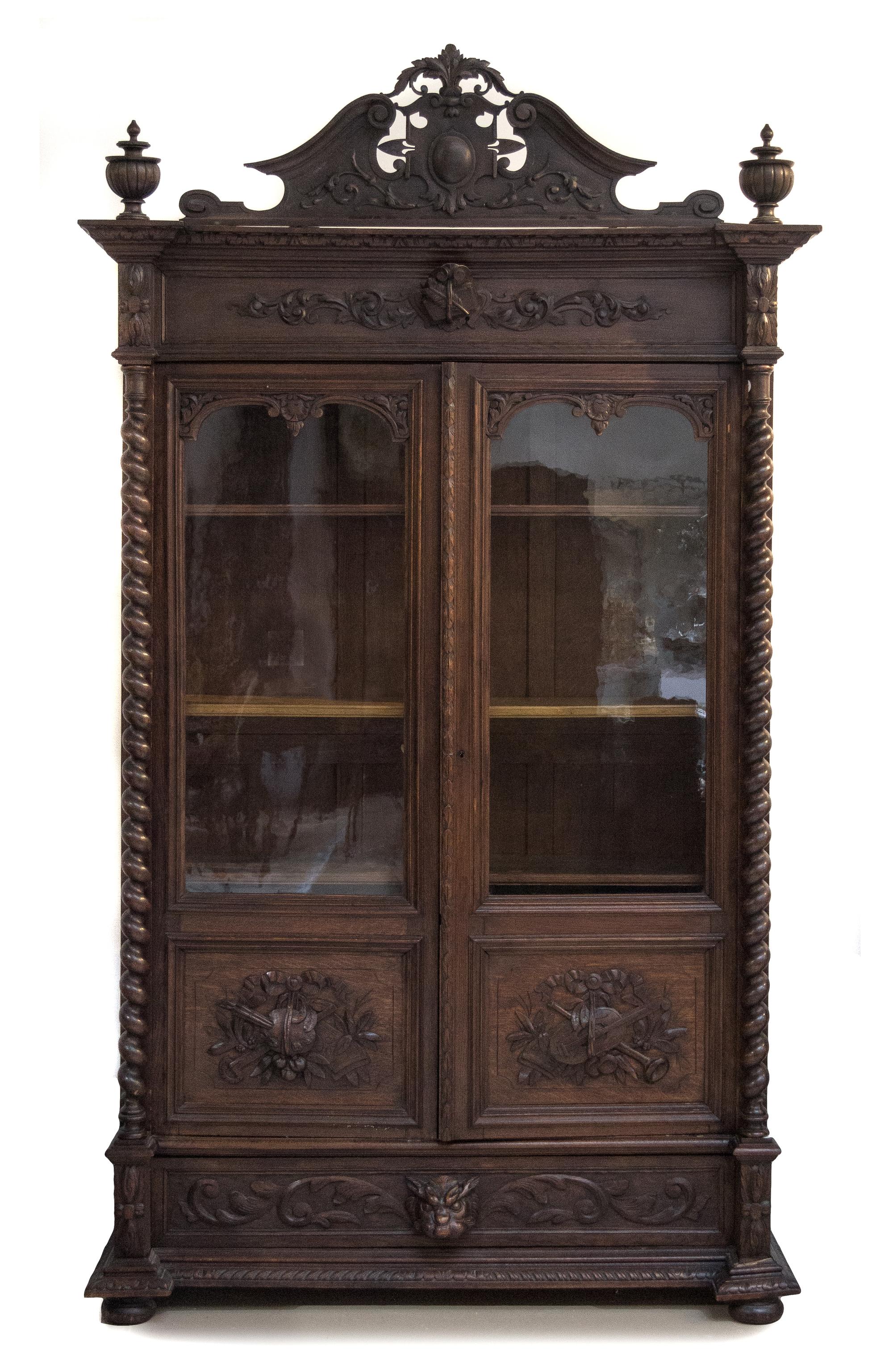 A Renaissance Revival Oak Vitrine Height 106 x width 60 x depth 22 inches. — FIRST HALF 20TH CENTURY
