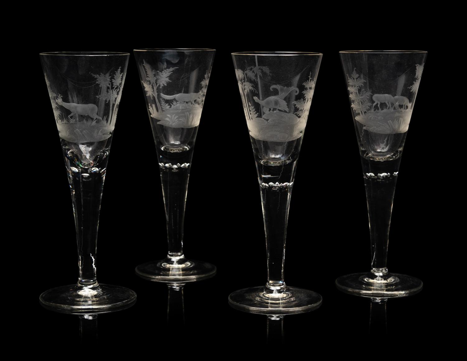 A Set of Four Large Etched Glass Wine Stems