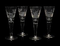 A Set of Four Large Etched Glass Wine Stems