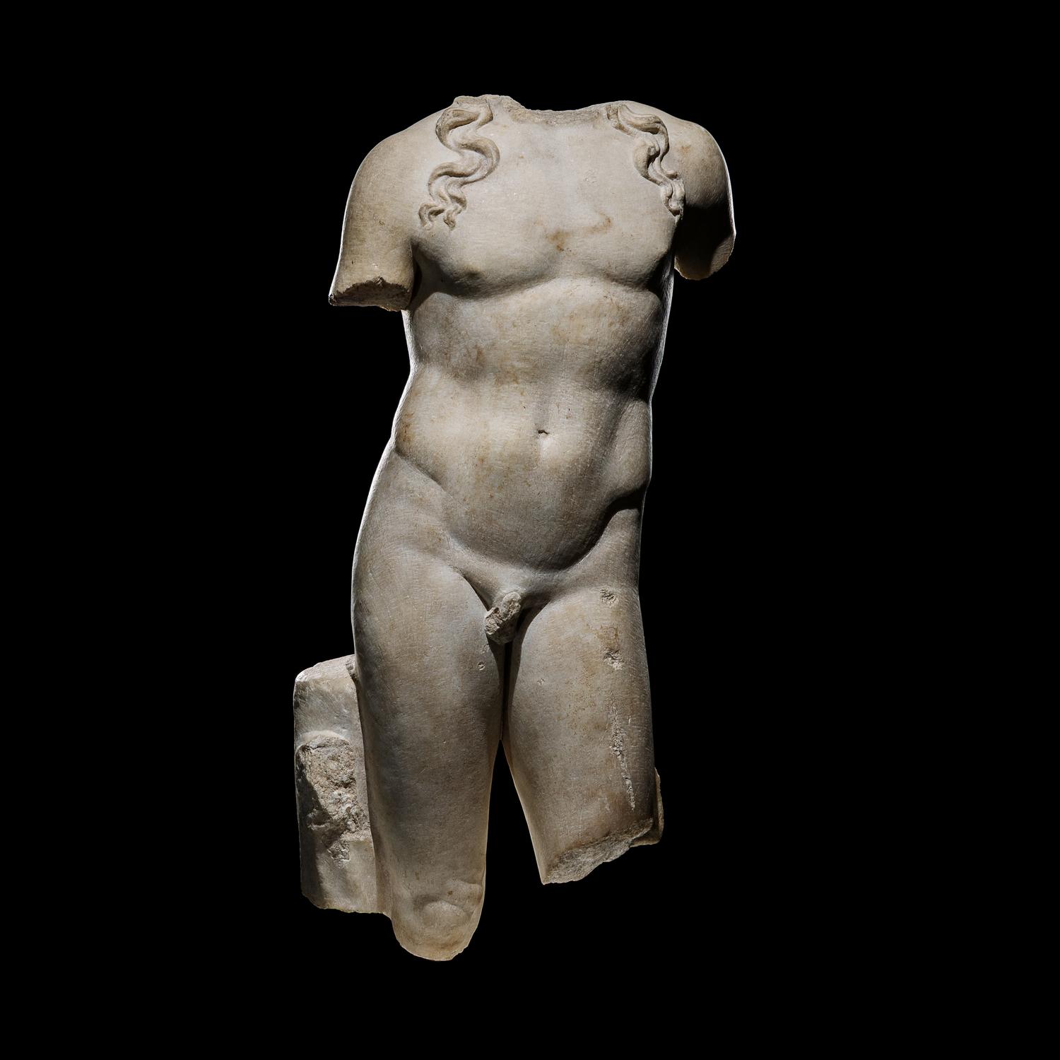 A Roman Marble Torso of a Youthful God