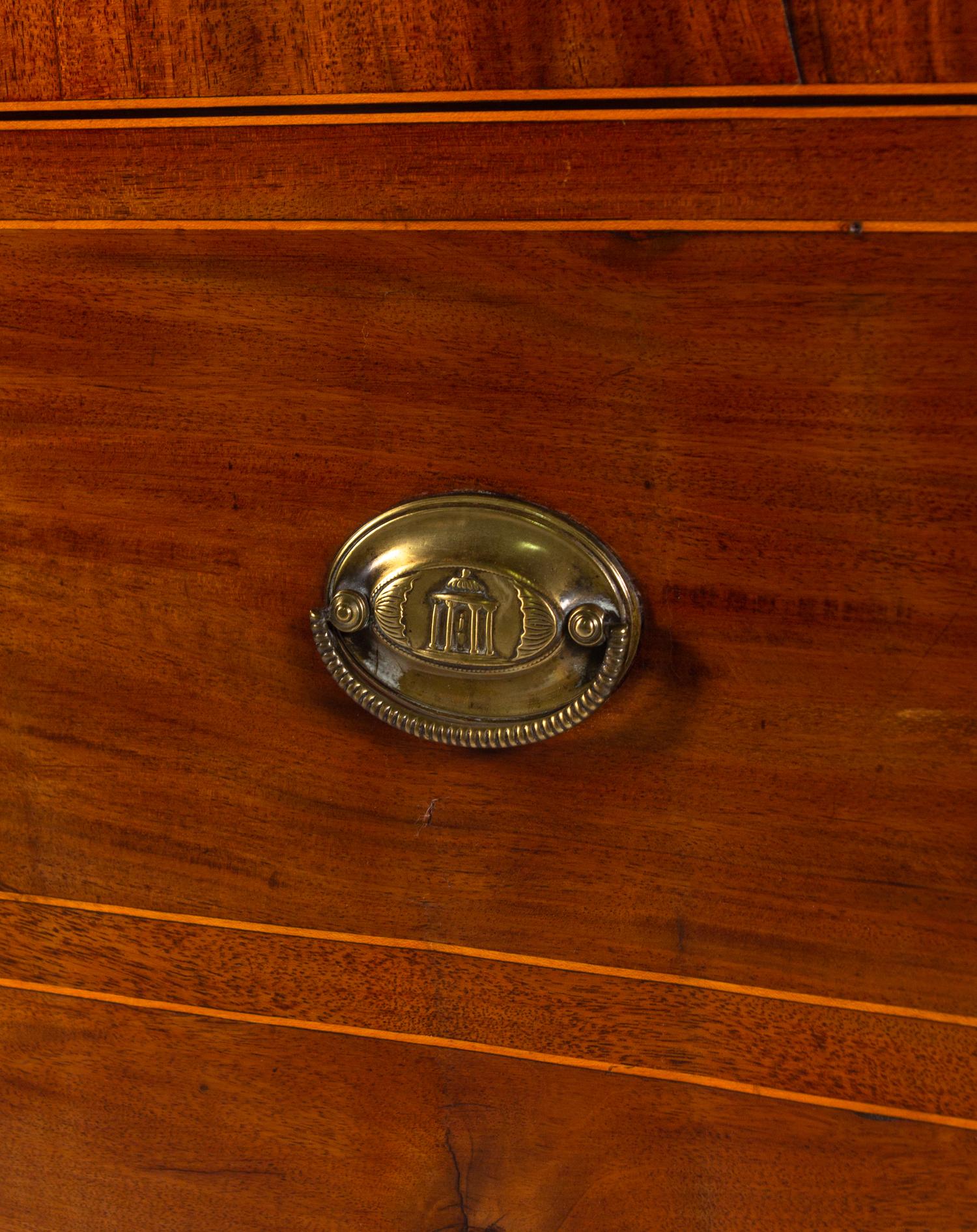 A Regency Mahogany Armoire Simulating a Linen Press