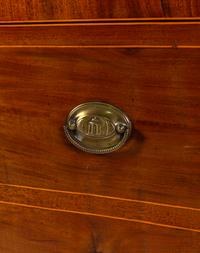 A Regency Mahogany Armoire Simulating a Linen Press