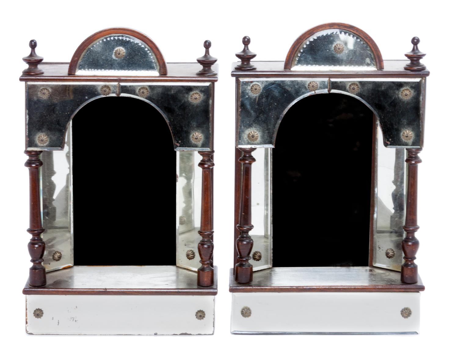A Pair of Ebonized and Mirrored Brackets Height 13 1/2 inches.