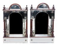 A Pair of Ebonized and Mirrored Brackets Height 13 1/2 inches.