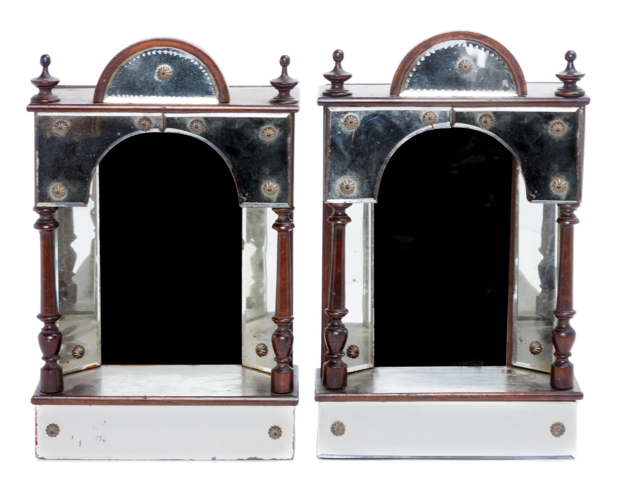 A Pair of Ebonized and Mirrored Brackets Height 13 1/2 inches.