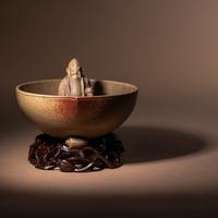A Rare Yixing Peach-Form 'Figure' Puzzle Cup with Impressed Seals 'Chen', 'Mingyuan' and Wood Stand 陳鳴遠款醉翁桃形公道杯