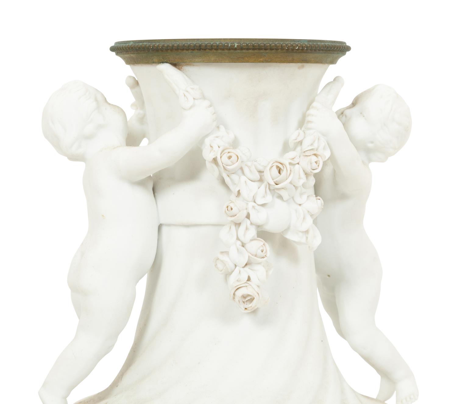 A Pair of Gilt Metal Mounted Bisque Porcelain Urns