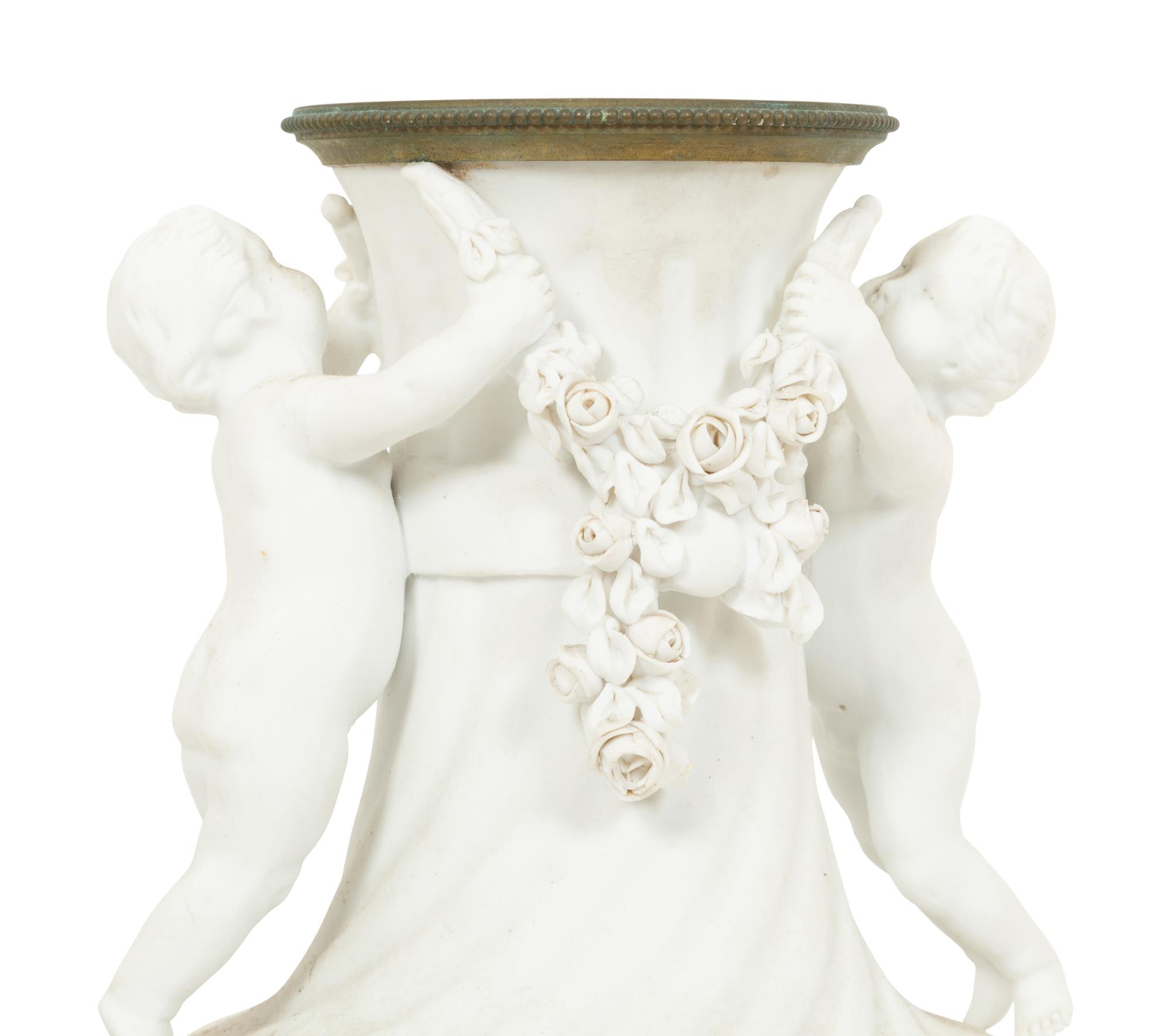 A Pair of Gilt Metal Mounted Bisque Porcelain Urns
