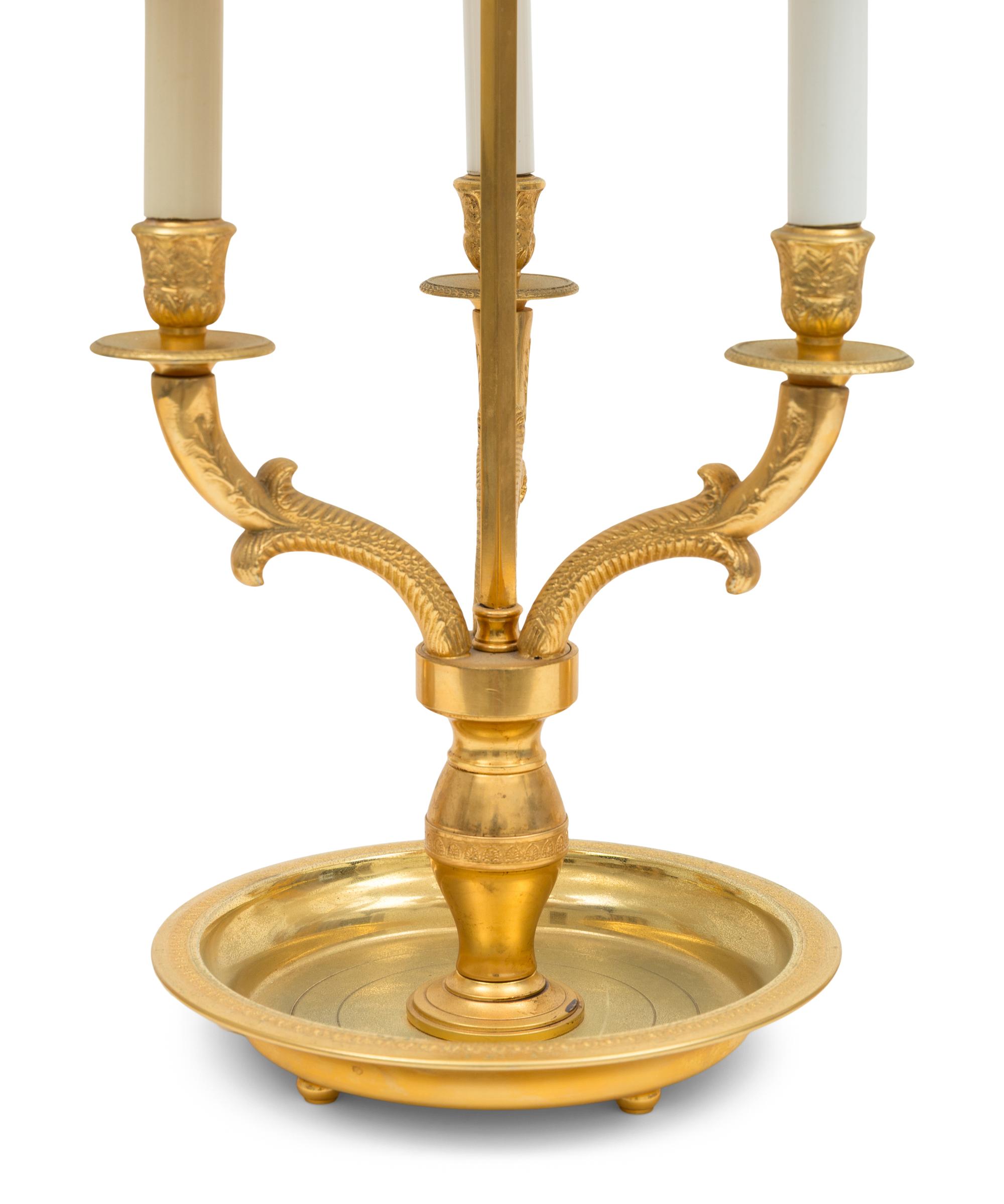 A Trio of French Empire Style Gilt Bronze Bouillotte Lamps with Tole Painted Shades