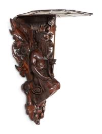 A Pair of Carved Oak Figural Wall Brackets