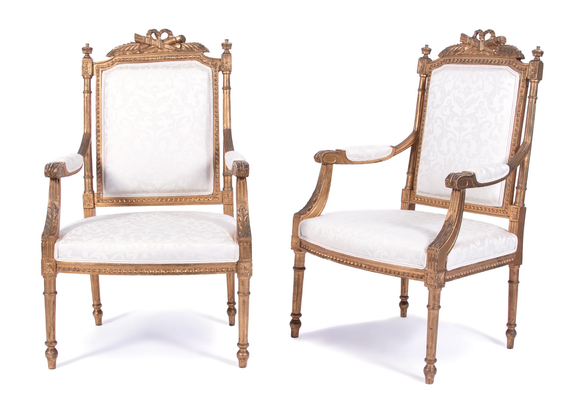 A Pair of Louis XVI Style Carved Giltwood Fauteuils Height 40 inches. — 19TH CENTURY