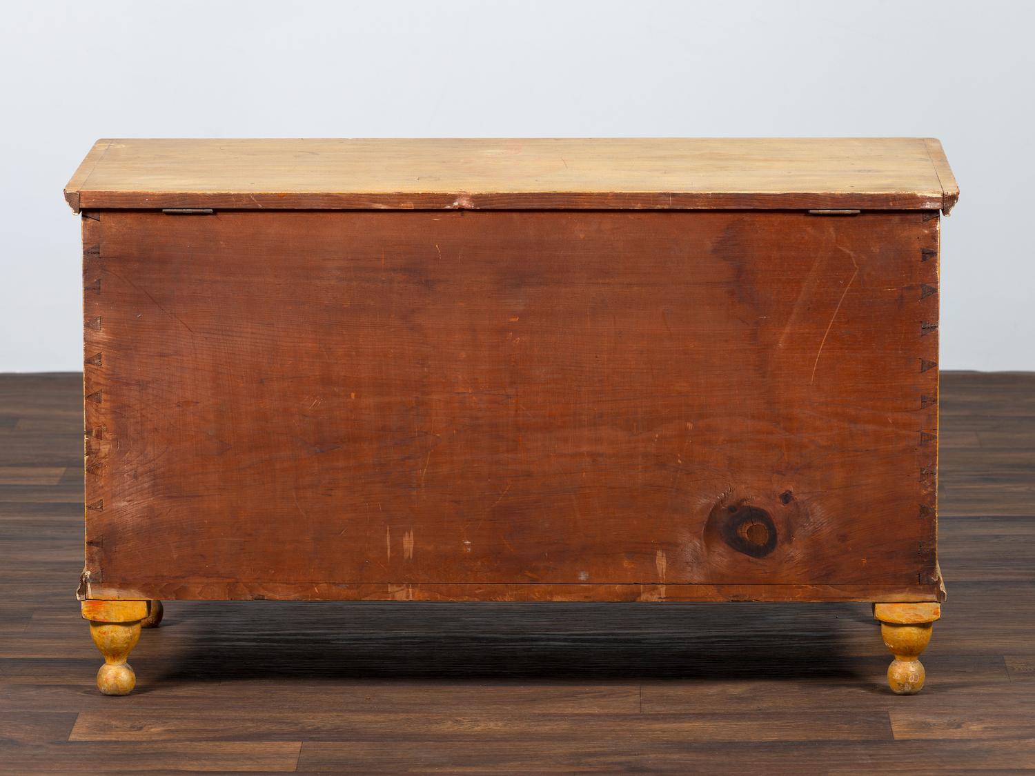 A Country Yellow and Red Paint Decorated Pine Blanket Chest
