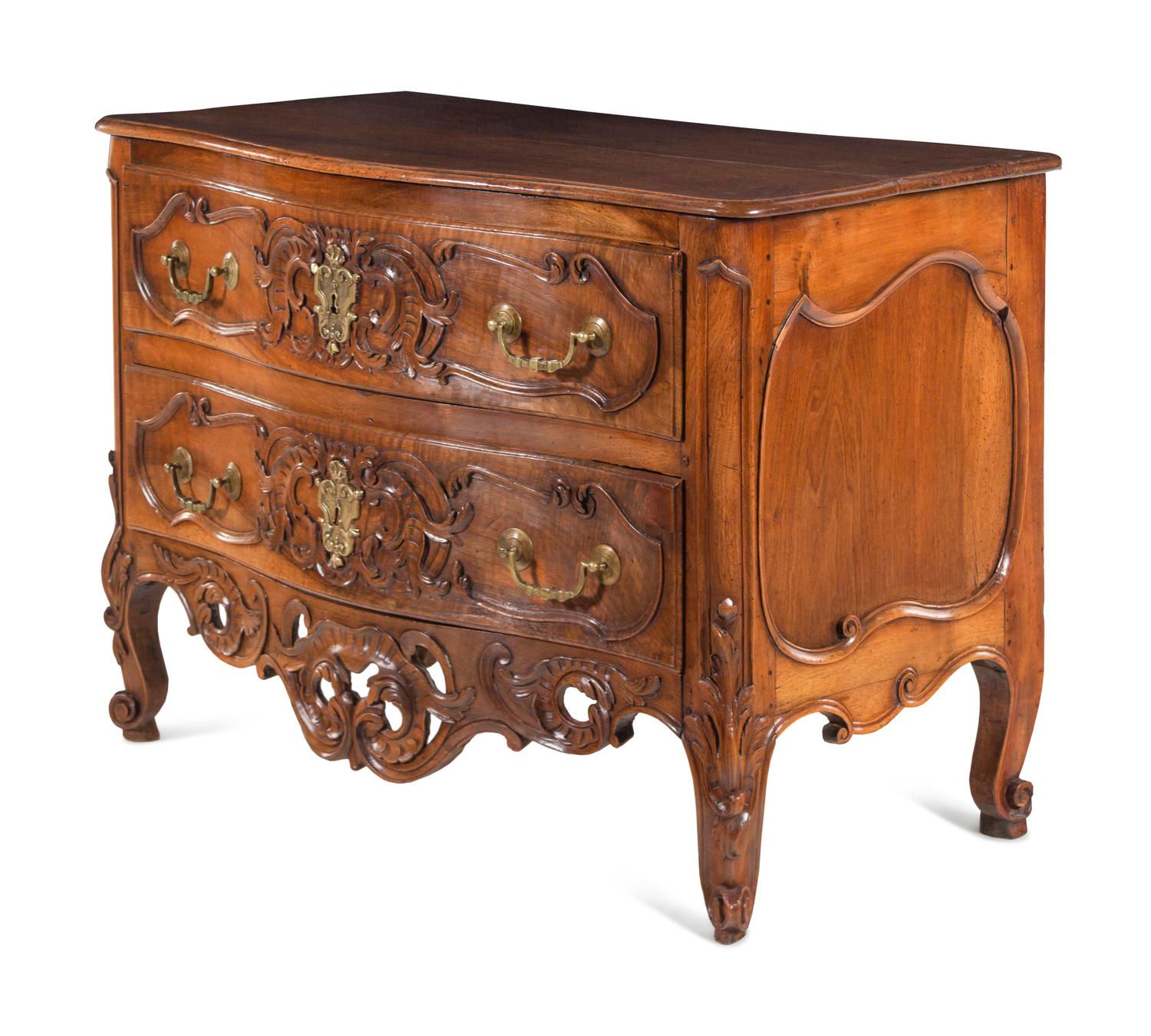 A Louis XV Provincial Carved Walnut Commode