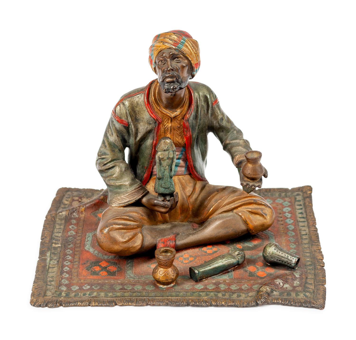 An Austrian Cold-Painted Bronze Figure of a Seated Merchant