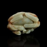 A Chinese greyish-celadon and russet jade recumbent beast and lotus group 青玉雕瑞兽衔荷花 18th century or earlier ???????