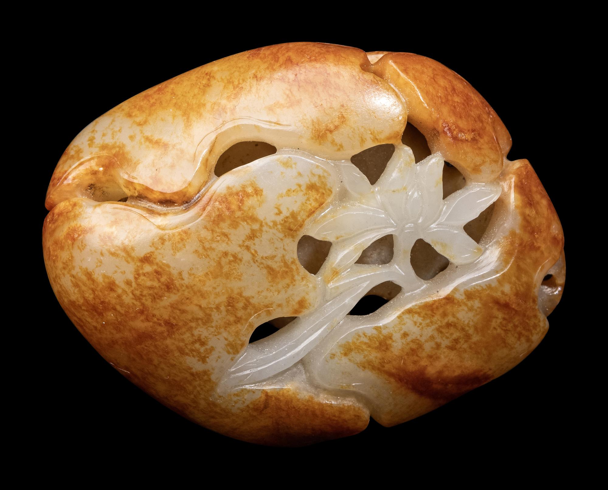 A Chinese Russet Jade 'Lotus and Leaf' Carving