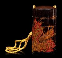 A Gold and Black Lacquer Four-Case Inro