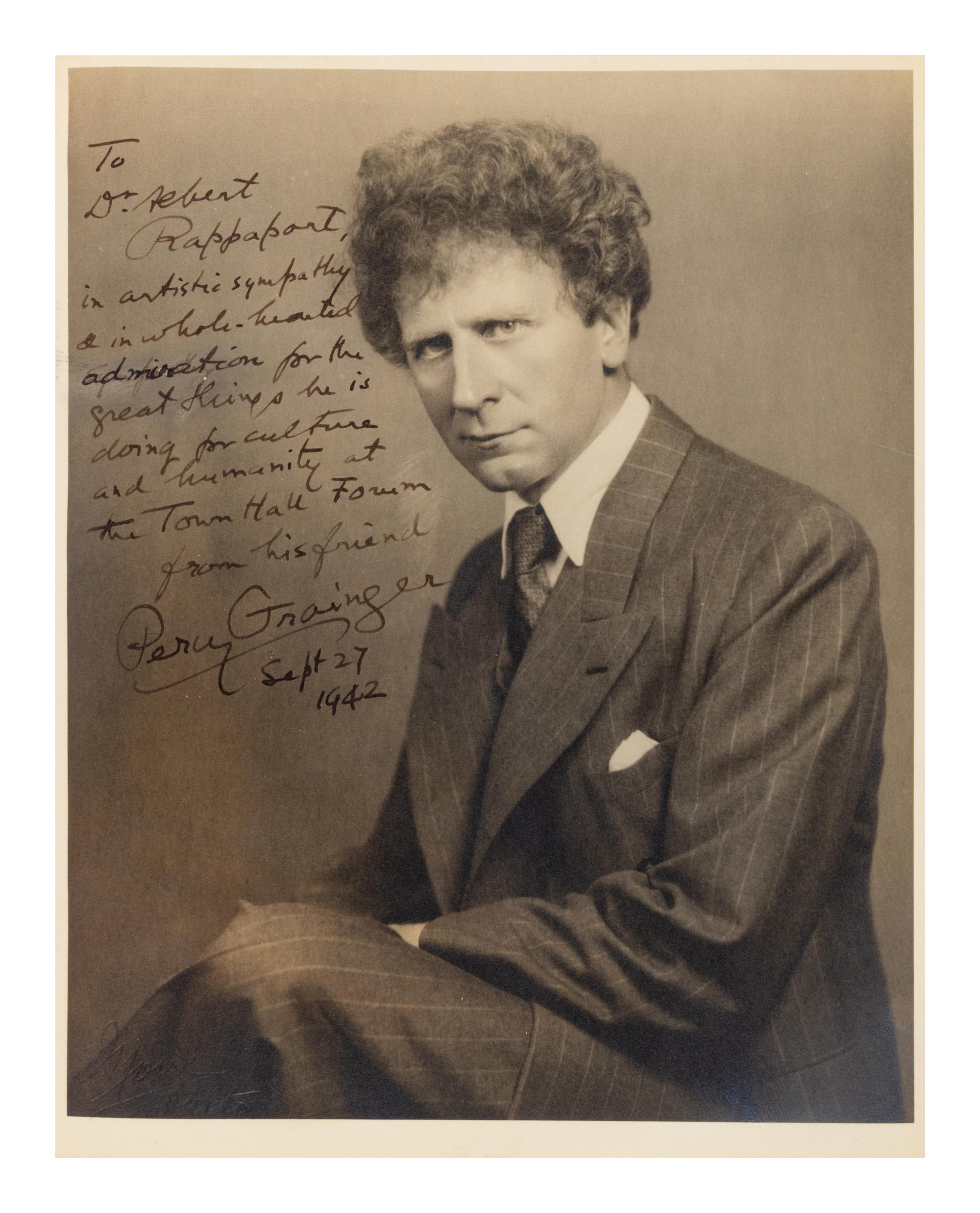 GRAINGER, Percy (1882-1961). Black and white photographic portrait, signed (“Percy Granger”) and additionally inscribed to Dr. Sebert Rappaport, 27 September 1942.