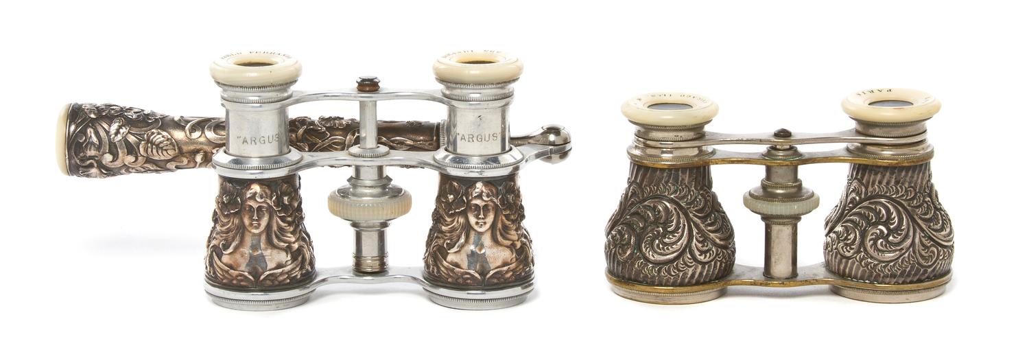 Two Pairs of Continental Silver or Silvered Metal Cased Opera Glasses, Width of first 3 3/4 inches.