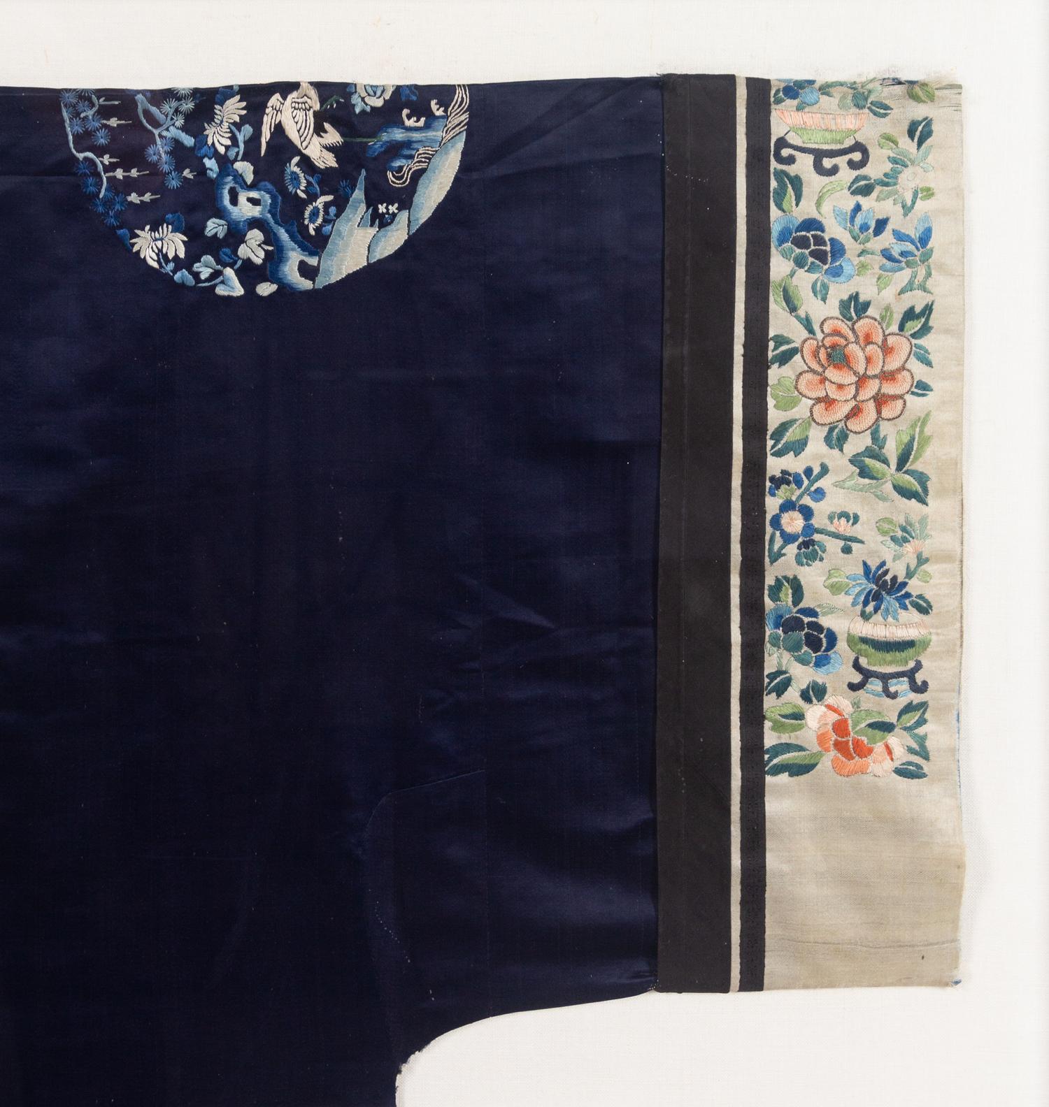 A Chinese Dark Blue Ground Embroidered Silk Lady's Robe