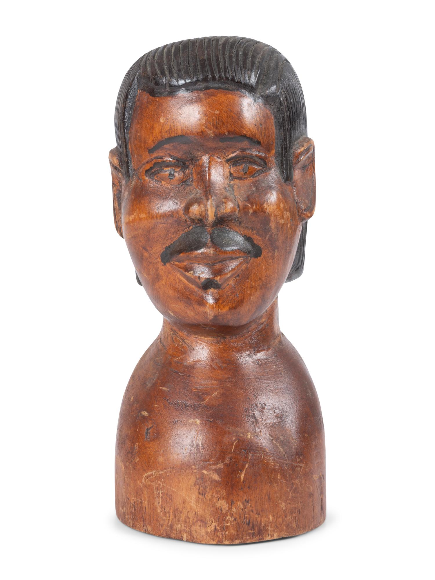 A Carved and Painted Wood Bust of a Mustachioed Man