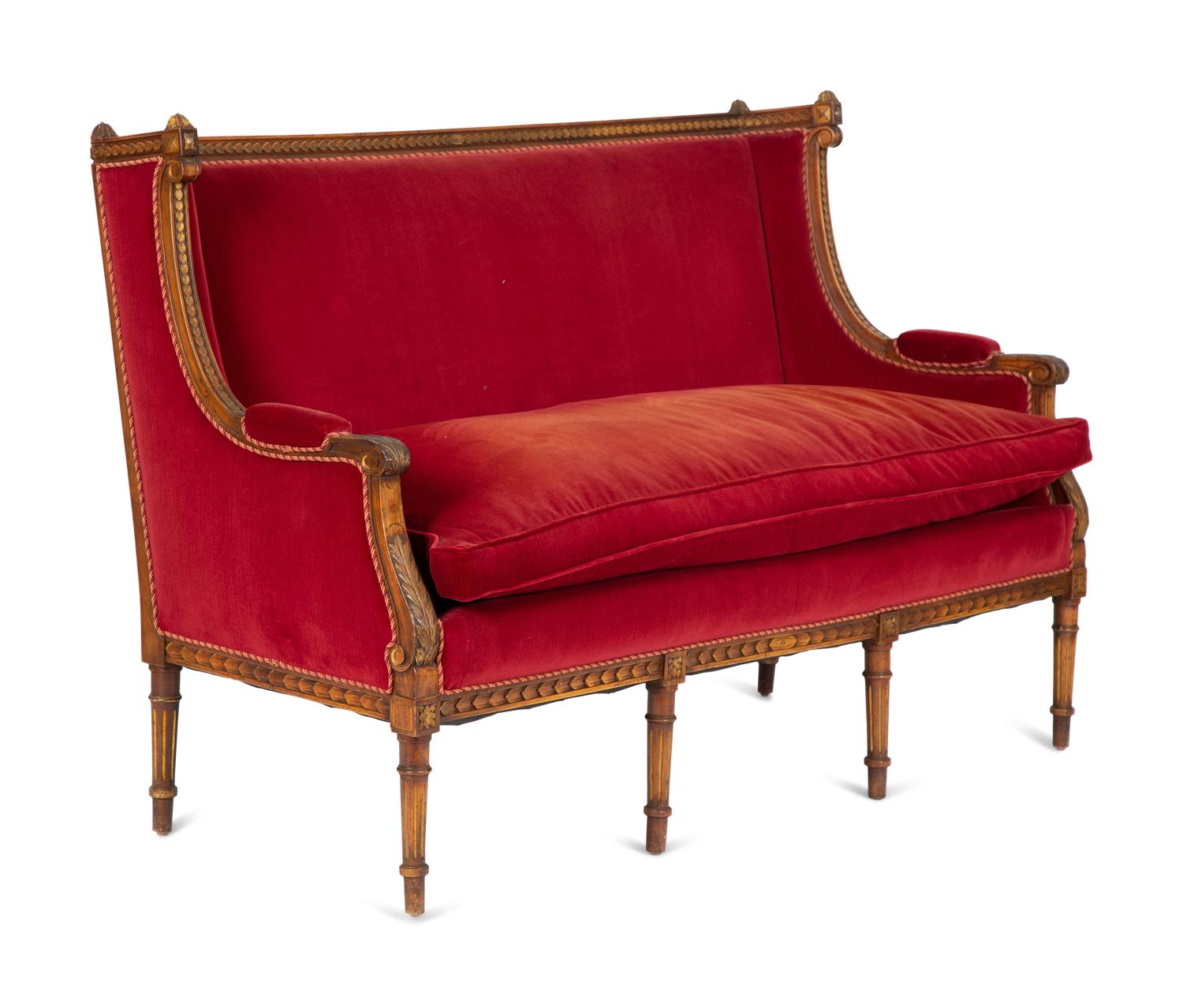 A Louis XVI Style Parcel Gilt Walnut Sofa