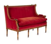 A Louis XVI Style Parcel Gilt Walnut Sofa