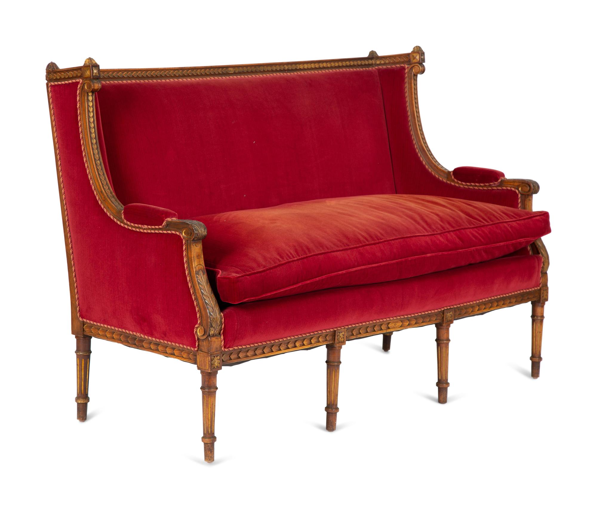 A Louis XVI Style Parcel Gilt Walnut Sofa
