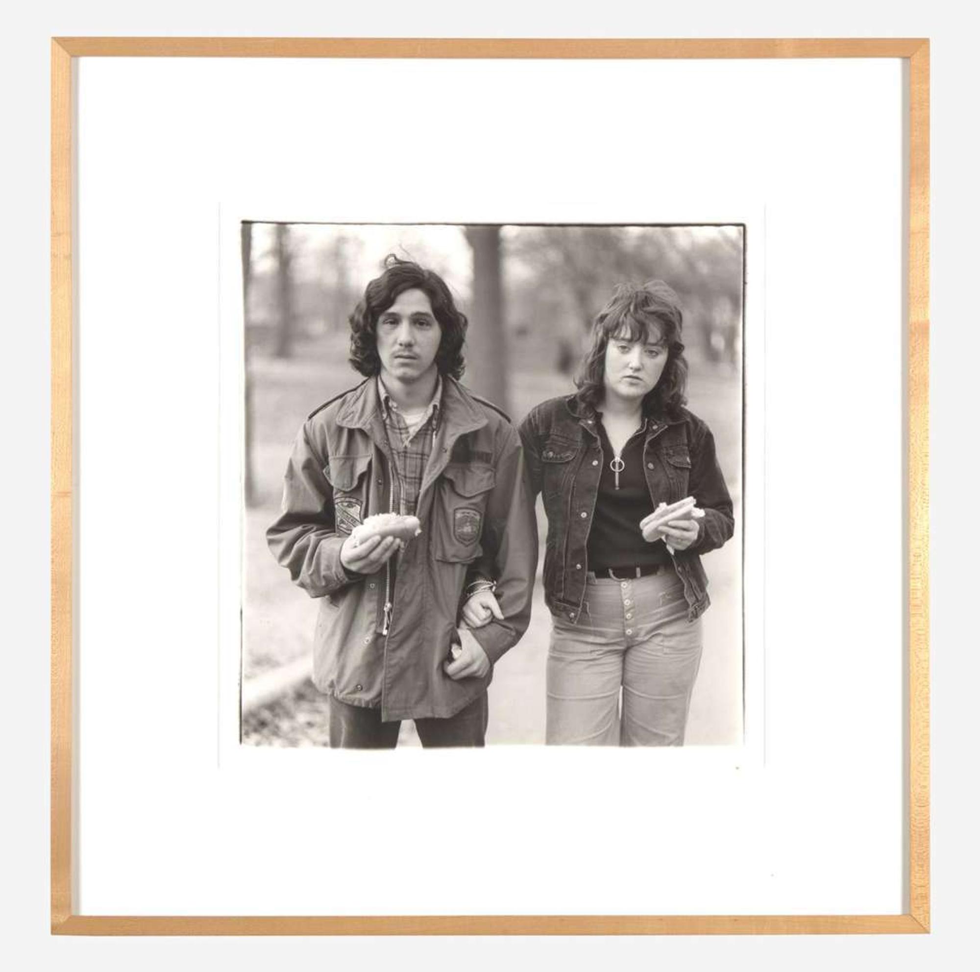 Diane Arbus (American, 1923-1971) A Young Man and His Girlfriend with Hot Dogs in the Park, N.Y.C.