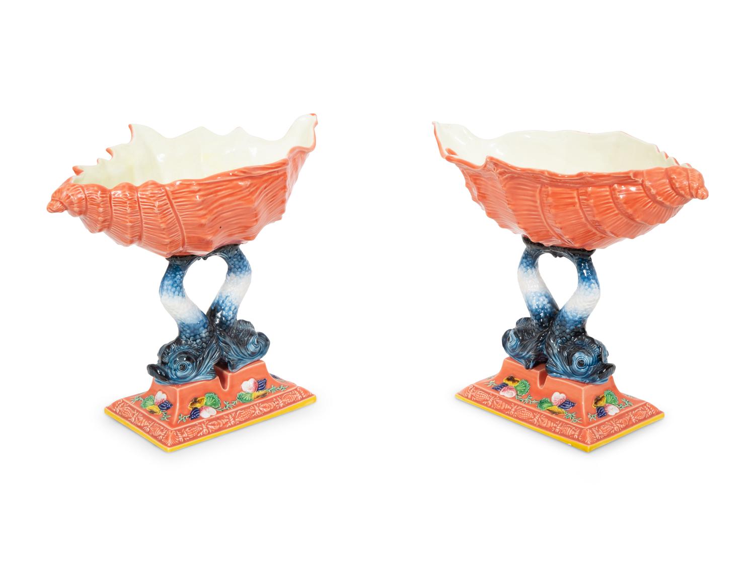 A Pair of Italian Glazed Ceramic Shell-form Compotes on Dolphin Supports