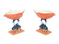 A Pair of Italian Glazed Ceramic Shell-form Compotes on Dolphin Supports