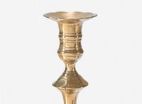 A group of ten George II scallop or petal-base brass candlesticks, England, 18th century