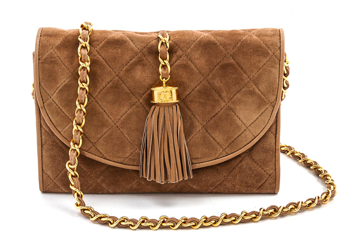 A Chanel Tan Suede Quilted Flap Bag, 8 x 5 1/2 x 1 1/2 inches.