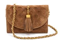 A Chanel Tan Suede Quilted Flap Bag, 8 x 5 1/2 x 1 1/2 inches.