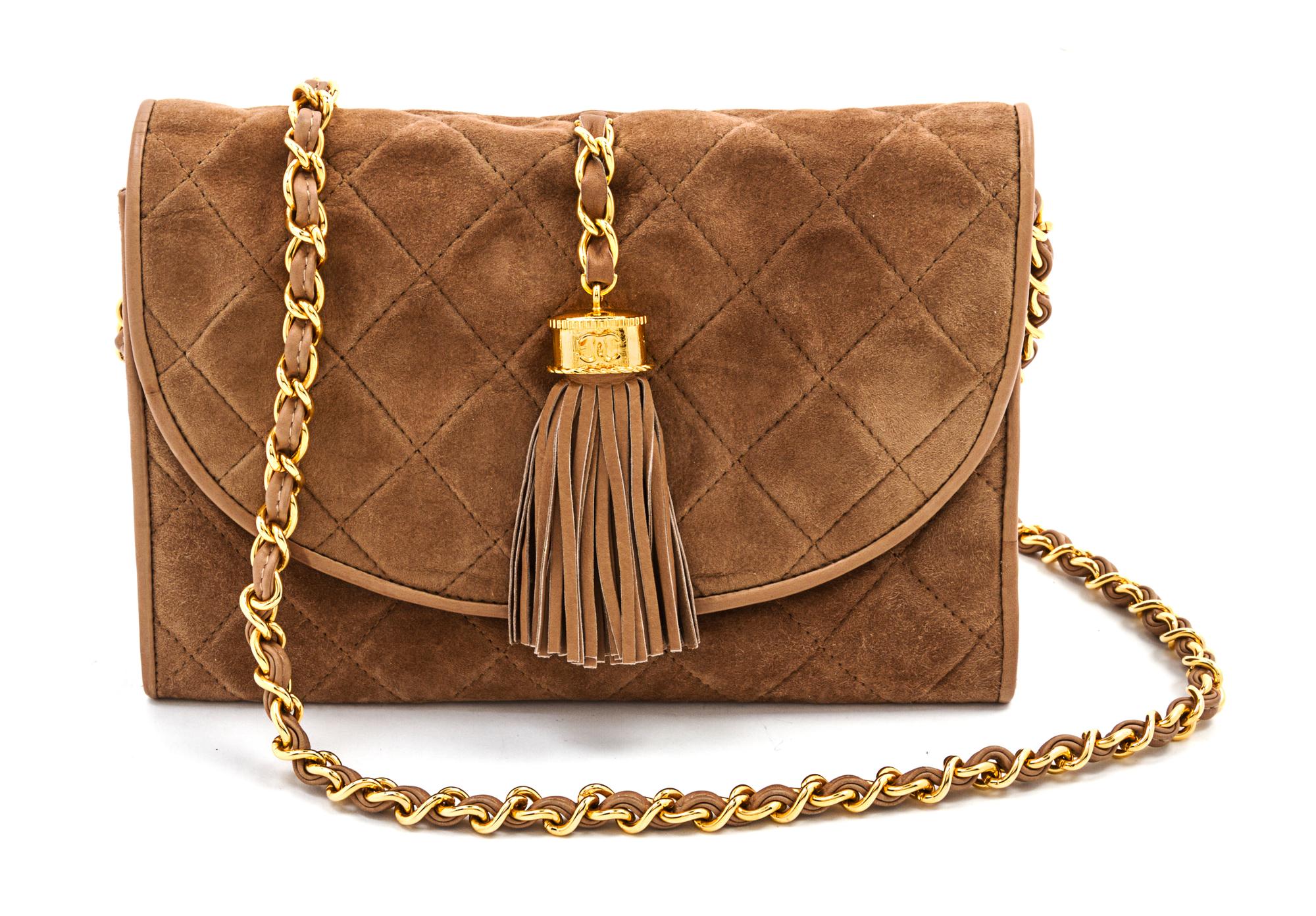 A Chanel Tan Suede Quilted Flap Bag, 8 x 5 1/2 x 1 1/2 inches.