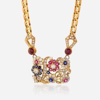 An eighteen karat gold, diamond, sapphire, and ruby necklace