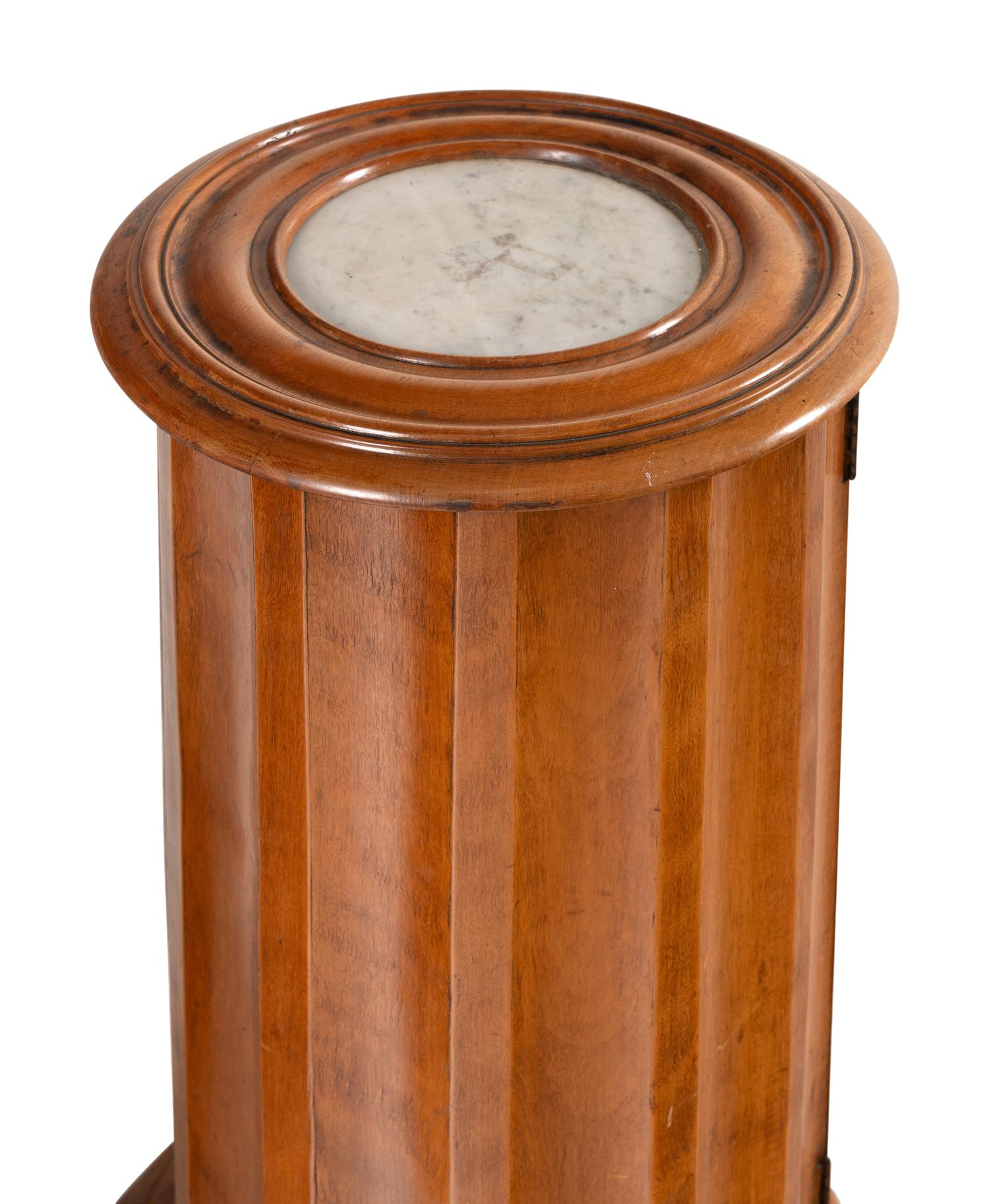 A Set of Three Continental Satin Birch Marble-Top Pedestal Cabinets