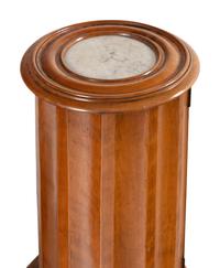 A Set of Three Continental Satin Birch Marble-Top Pedestal Cabinets